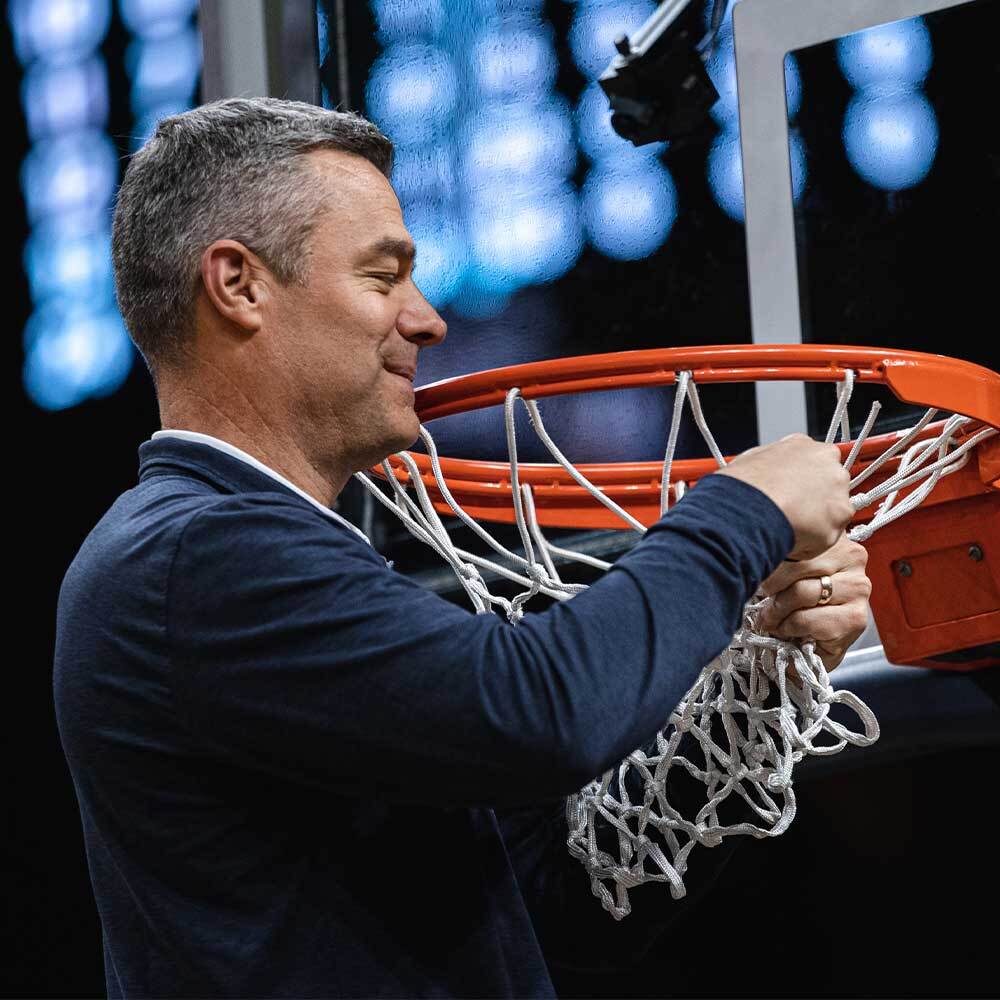 Tony Bennett cutting the net after an ACC Men's Basketball Championship Game