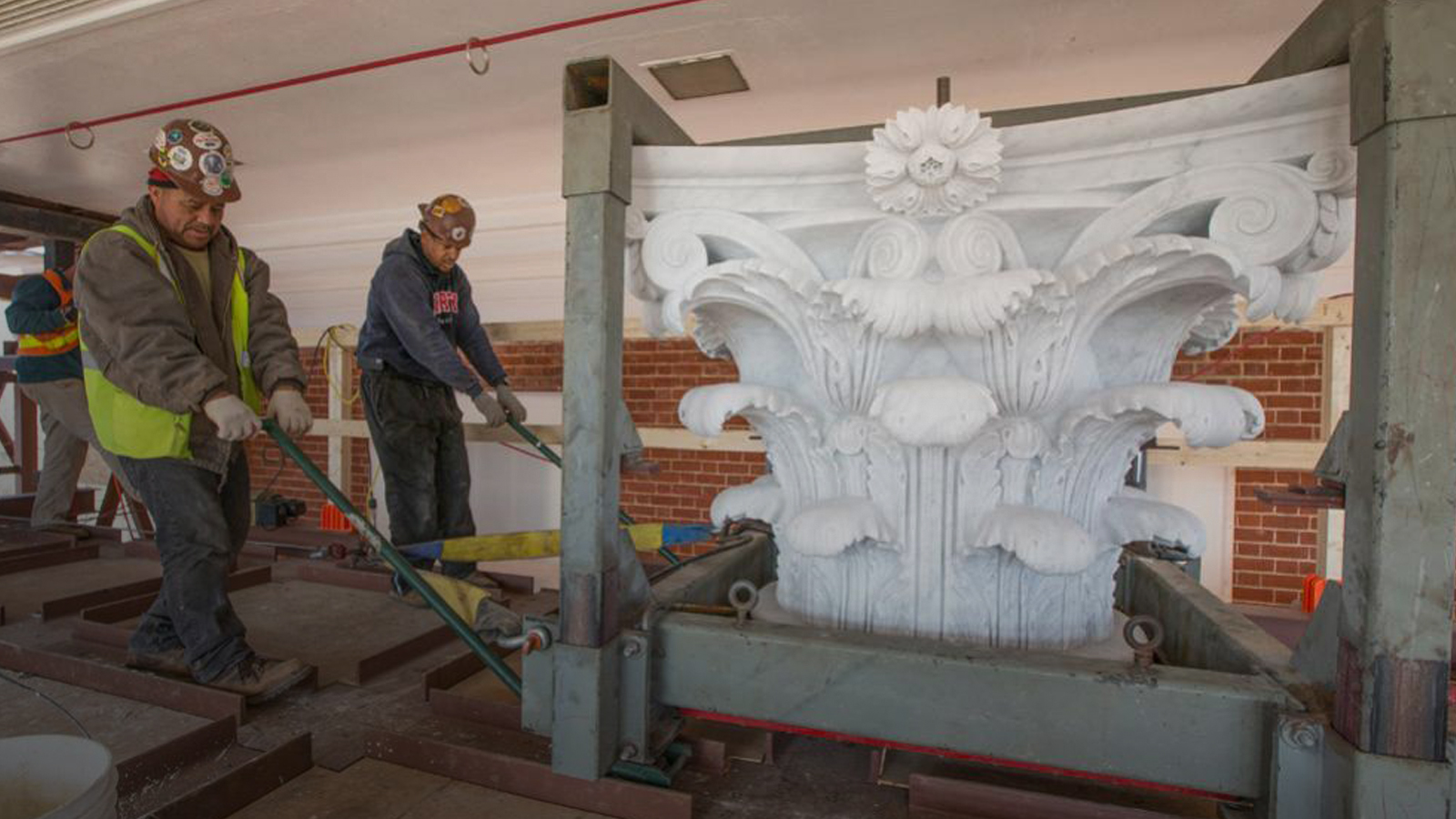 Portrait of a UVA construction worker restoring the rotunda capitals